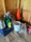 grouping of watering cans, insect killer, traffic cones, milk crate