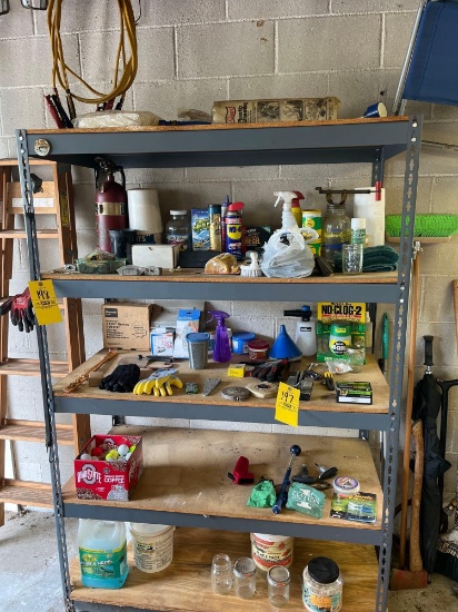 contents on shelf, jumper cables, golf balls, tools, etc