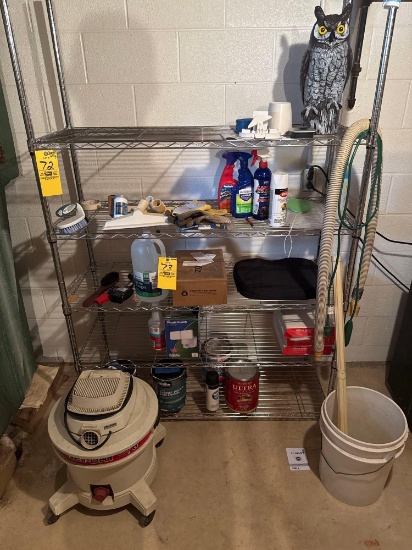 Contents on shelf; vacuum, paint, owl, gloves, paper, Heath Zenith, white viniger