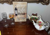 Wine rack, tea pots, stemware glasses (10 each)