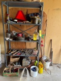 Contents of shelf; hitches, hand tools, weights, caution sign, wd40, jug, car battery, wire, glasses