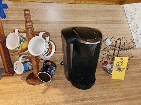 Keurig Coffee Maker, Mug Holder, Capsule Rack, & Mug Assortment