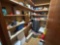 Contents of closet including fisher price toy, early games, Legos, file cabinet, magazines, fluids