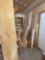 misc wood pile in corner - contents of cabinet on wall