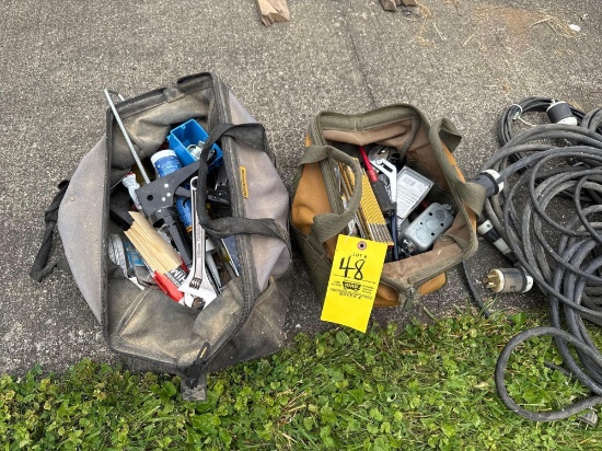 two tool bags fill of tools and hardware