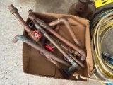 assorted copper pieces, bottle jack, rolls of wire