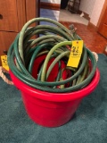 large red tub and garden hose