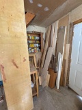 misc wood pile in corner - contents of cabinet on wall