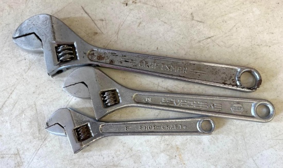 three adjustable wrenches