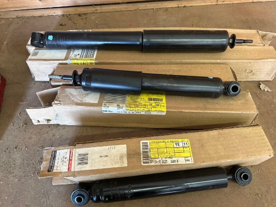 two pairs of new in the box shocks and one single