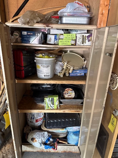 Metal cabinet with contents - rope lights, mini electric fireplace/space heater, serving supplies