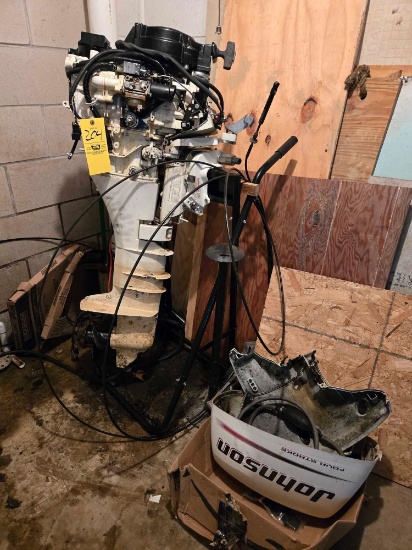 Johnson 9.9hp four stroke outboard motor w/ controls and stand (not running, needs head gasket))