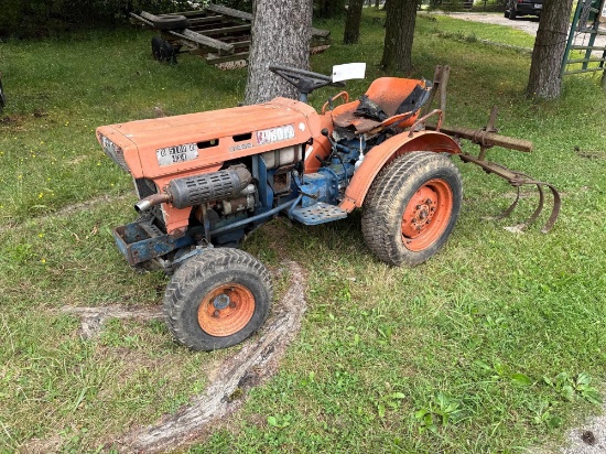 Kubota Diesel lawn tractor with rake attachment