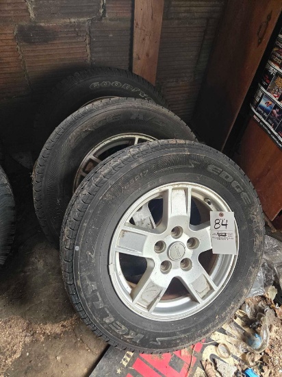 (3) Jeep rims with 245/65r17 tires