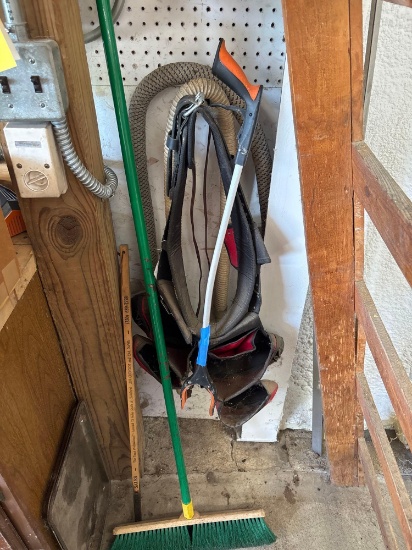 Tool belt, broom and walking stick