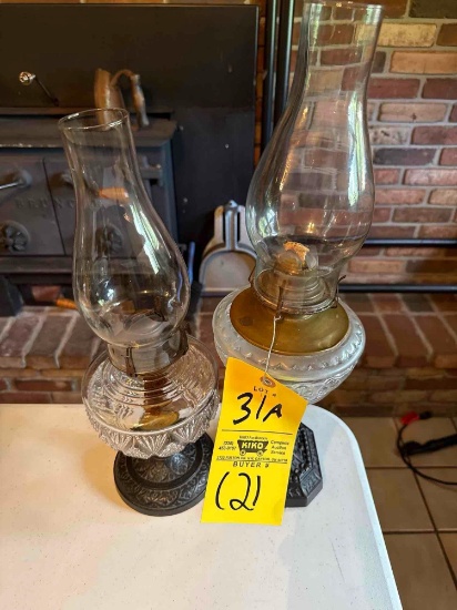 pair of oil lamps with heavy bases
