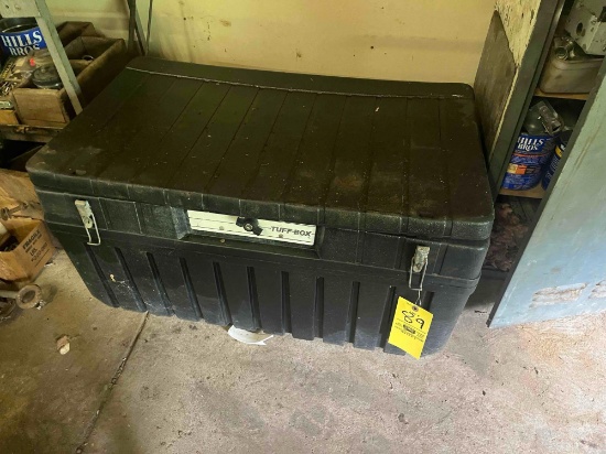 Plastic storage box loaded with assorted electrical wire and hose