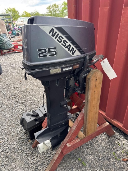 Nissan 25HP outboard engine with controls and gas tank