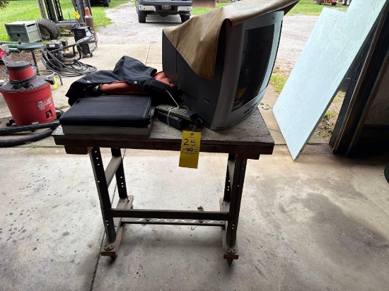 Old TV, Rain Suits, Power washing Apron. Rolling Desk