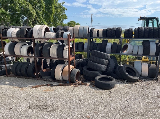 Large Assortment of Forklift Tires / Metal Racks
