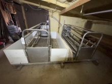 double stainless steel hog harrowing crate system on steel grate platform