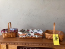 Three Longaberger baskets and silverware