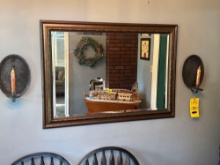 beveled mirror with wall sconces