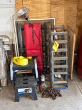 garage items, including Creeper, ramps, jack, toe strap, stools, cart, chain
