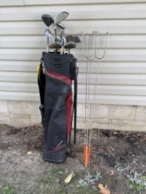 golf clubs and three hotdog sticks