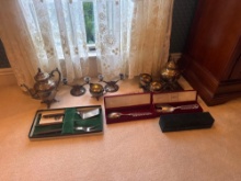 Silverplate tea sets and serving ware.