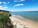 Showstopper on Lake Michigan’s Coastline at Manistee! 2 Acres of Magnificent views!