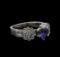 0.93 ctw Tanzanite and Diamond Ring - 18KT White Gold