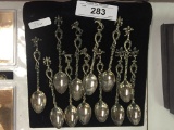 12 Figural Topped Spoons