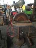 Grinding wheel, and stand