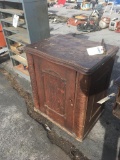 Vintage sewing machine, in antique cabinet