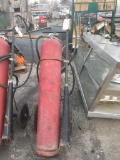 Two fire extinguishers, on carts