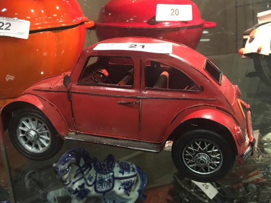 Collectible, red metal VW bug car