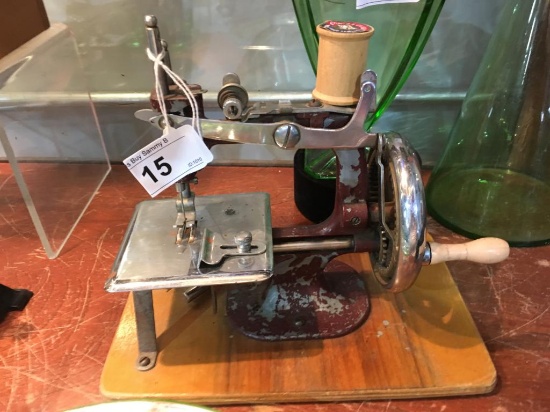 Vintage Heavy Metal Small Sewing Machine on Wood