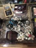assorted necklaces, pendants, belt buckles