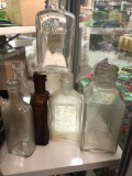 Assortment of vintage collectible bottles