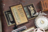 Box of old advertising thermometers