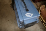 Small blue plastic kennel