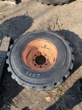 12?16.5 skid loader tire/rim/poor condition