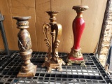 FOUR decorative candle holders, brown are 16.5 in. and 18in., red are 12 in. and 19.5 in.