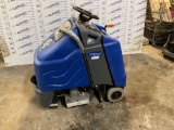 Automatic riding scrubber