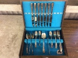 Incomplete silverware set in wooden case