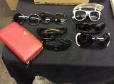 7 sunglasses and a prada like wallet