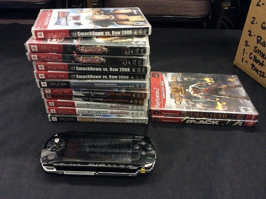Box with sony psp and 11 new unopened psp games and 2 playstation 2 games