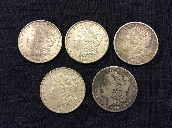 5 U S one dollar coins, years 1886,1881,1885,1880,1886