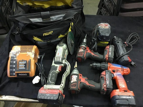Tool bag with various cordless and power tools